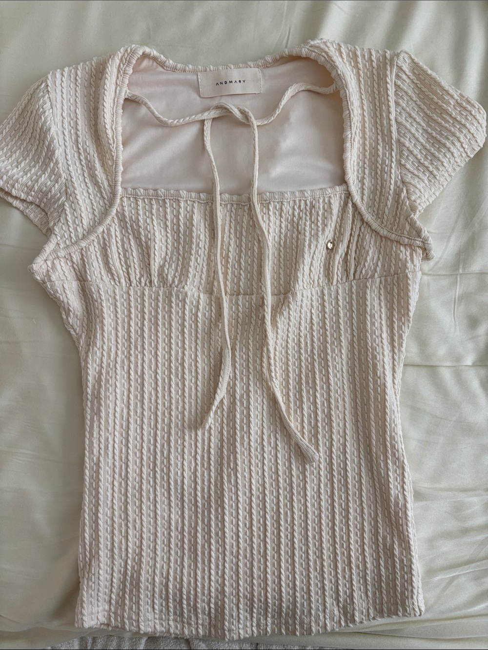 Japanese brand, Andmary Cream Textured Tie-Neck Short Sleeve Top
